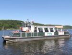 RiverQuest cruise boat with passengers.