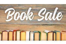 Here's an alt tag for the image: `Book sale: many books on display`